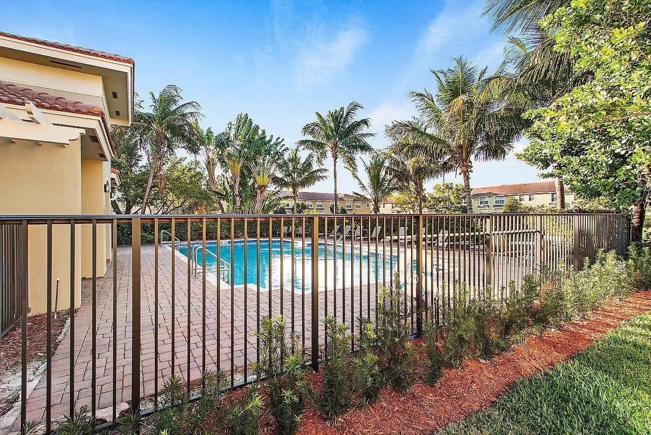 2851 Prospect Road Tamarac, FL 33309 - Photo 19 of 21 a view of a wrought iron fences in front of house