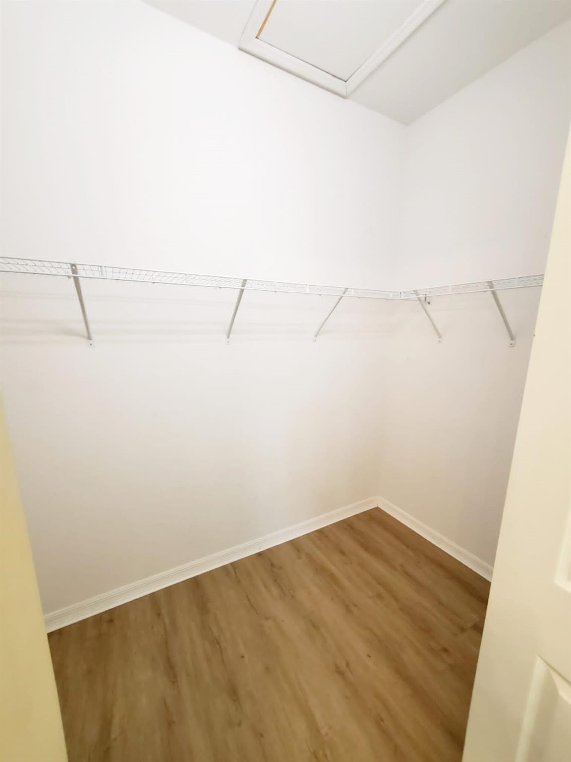 2851 Prospect Road Tamarac, FL 33309 - Photo 7 of 21 a view of a room with racks on the wall