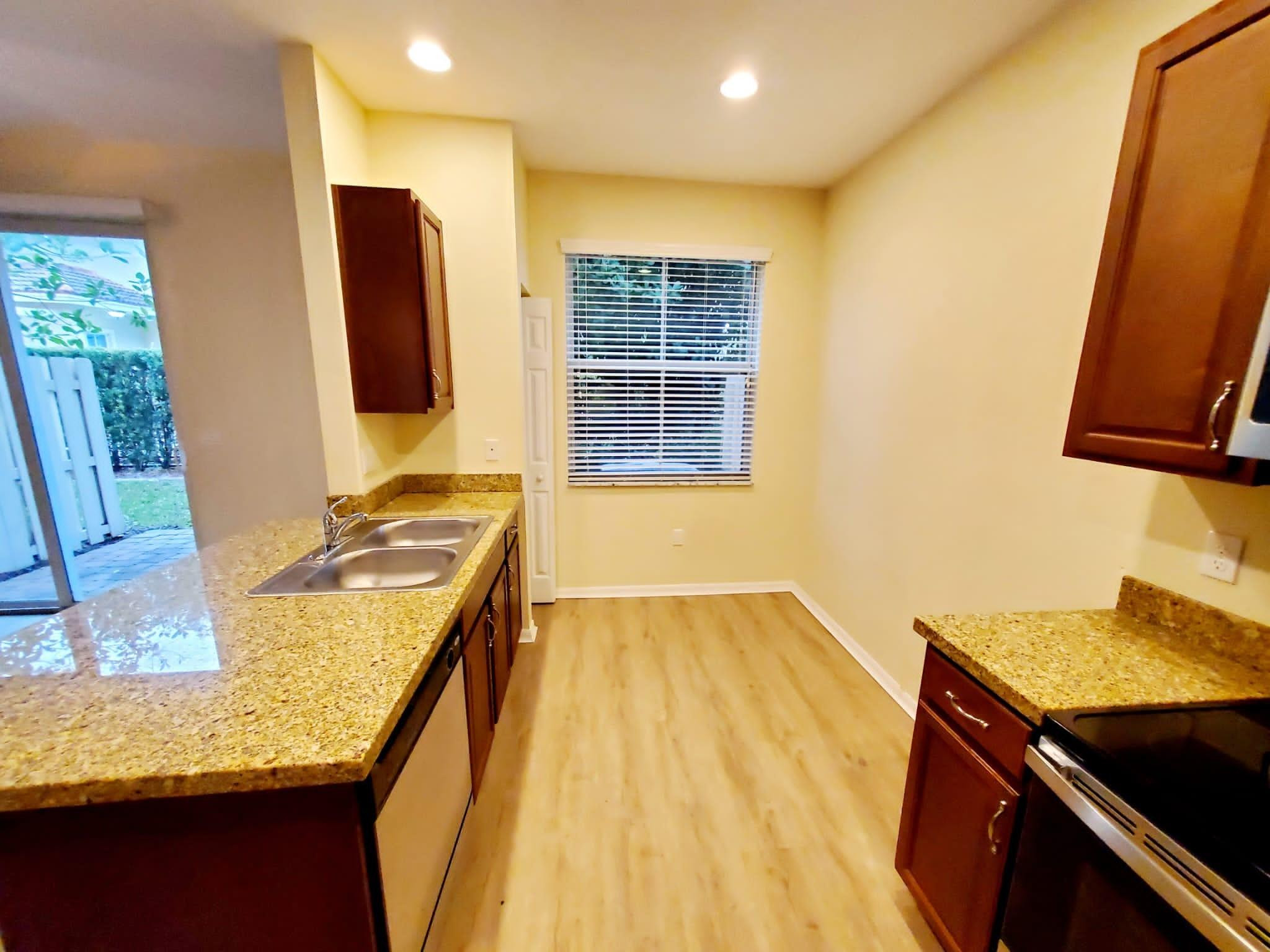 2851 Prospect Road Tamarac, FL 33309 - Photo 10 of 21 a bathroom with a granite countertop sink and a mirror
