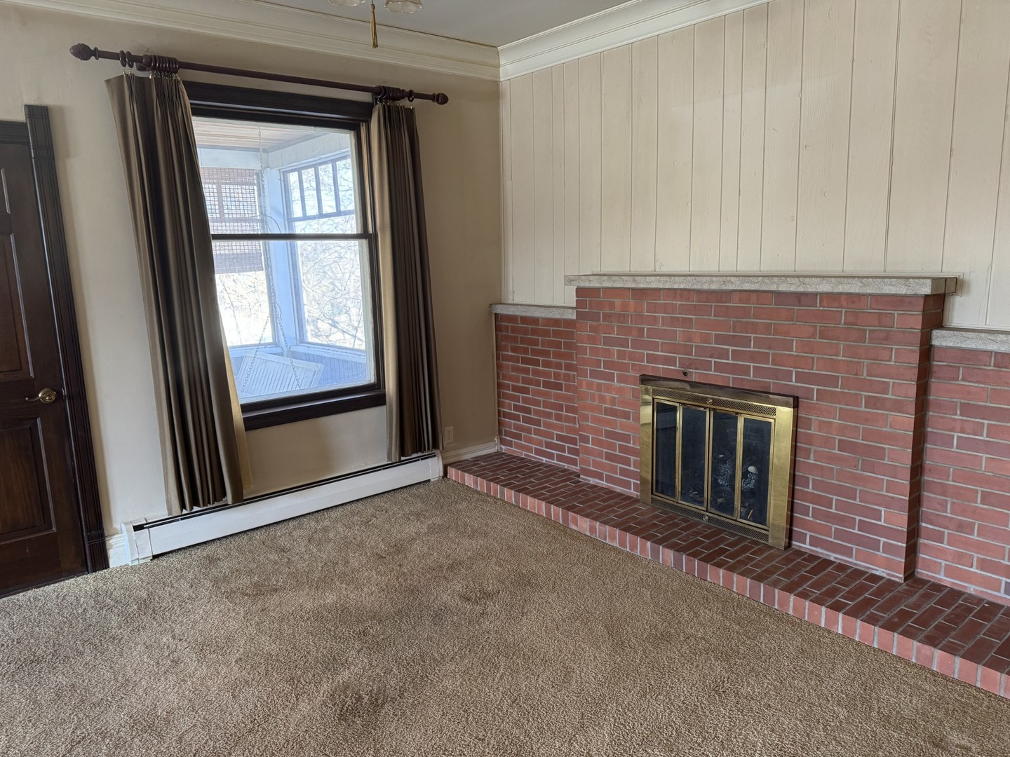 3 Trexler Avenue Oglesby, IL 61348 - Photo 6 of 20 a view of an empty room with a fireplace and a window