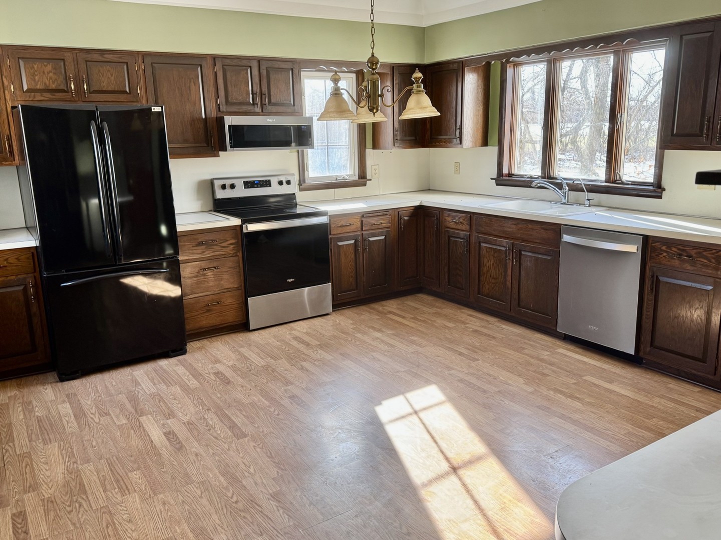 3 Trexler Avenue Oglesby, IL 61348 - Photo 8 of 20 a kitchen with stainless steel appliances granite countertop a refrigerator and a sink