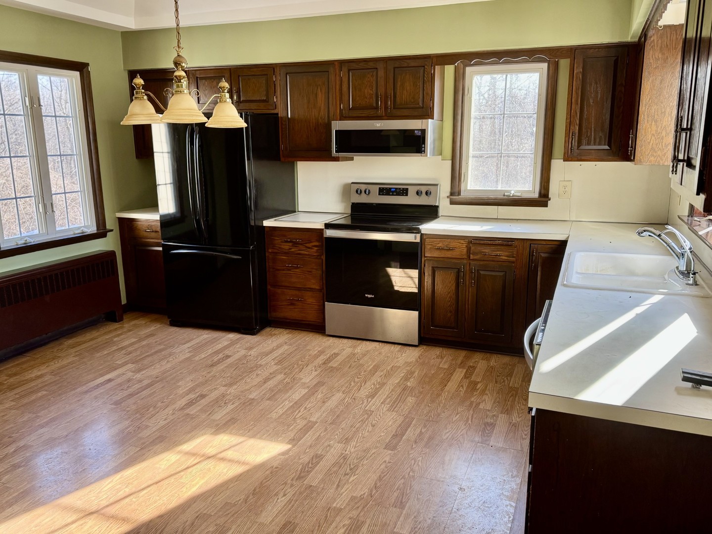 3 Trexler Avenue Oglesby, IL 61348 - Photo 9 of 20 a kitchen with stainless steel appliances kitchen island granite countertop a refrigerator stove top oven and sink