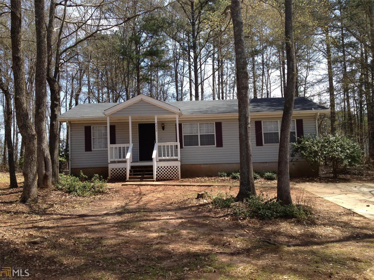 4236 Flat Rock Road Lithonia, GA 30038 - Photo 1 of 1 a front view of a house with a yard