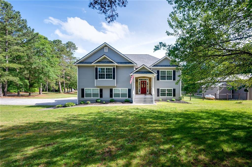 1520 Daniel Road Villa Rica, GA 30180 - Photo 1 of 1 a front view of a house with a yard