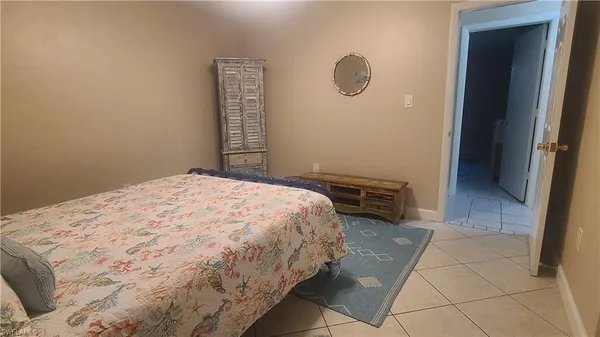 a bedroom with a bed and a shower