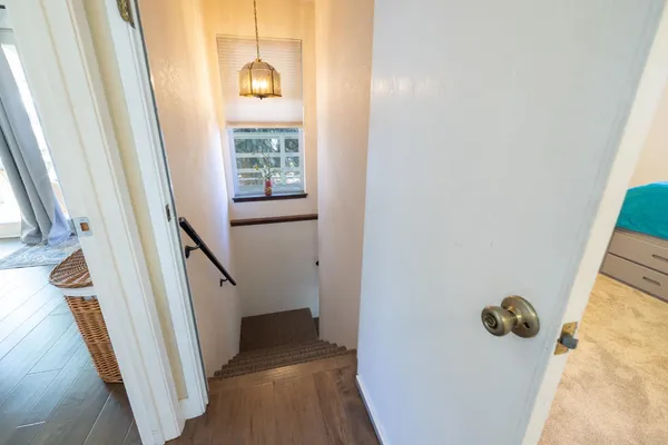a view of a porch with furniture and a yard