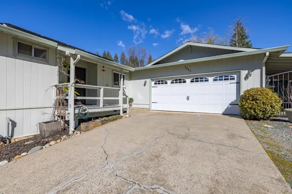 a front view of a house with a garage