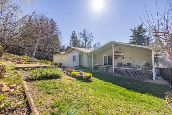 a view of a lake with large trees