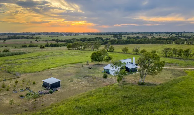 a view of a lake with a yard