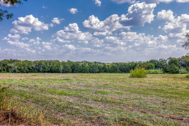 a view of an ocean and yard