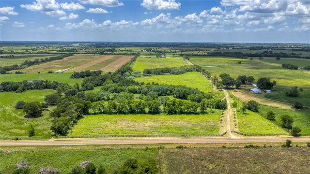 a view of a swimming pool and an outdoor space
