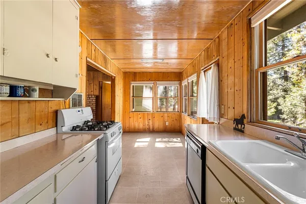 a view of a large kitchen with a large window