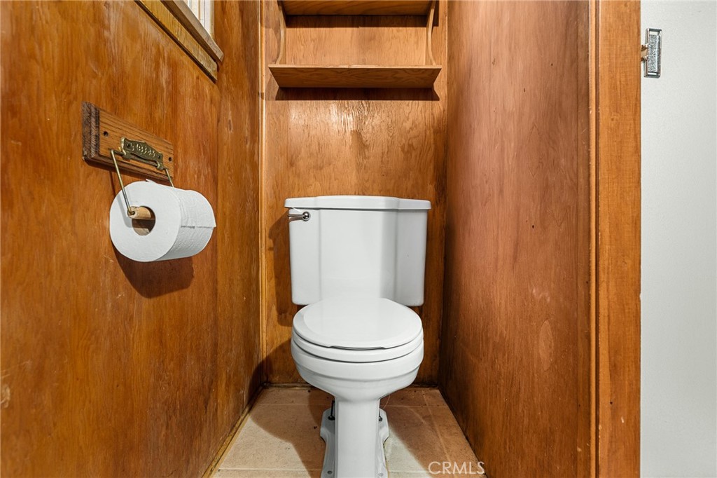 25455 Tahquitz Road Idyllwild, CA 92549 - Photo 7 of 25 a bathroom with a toilet and a sink