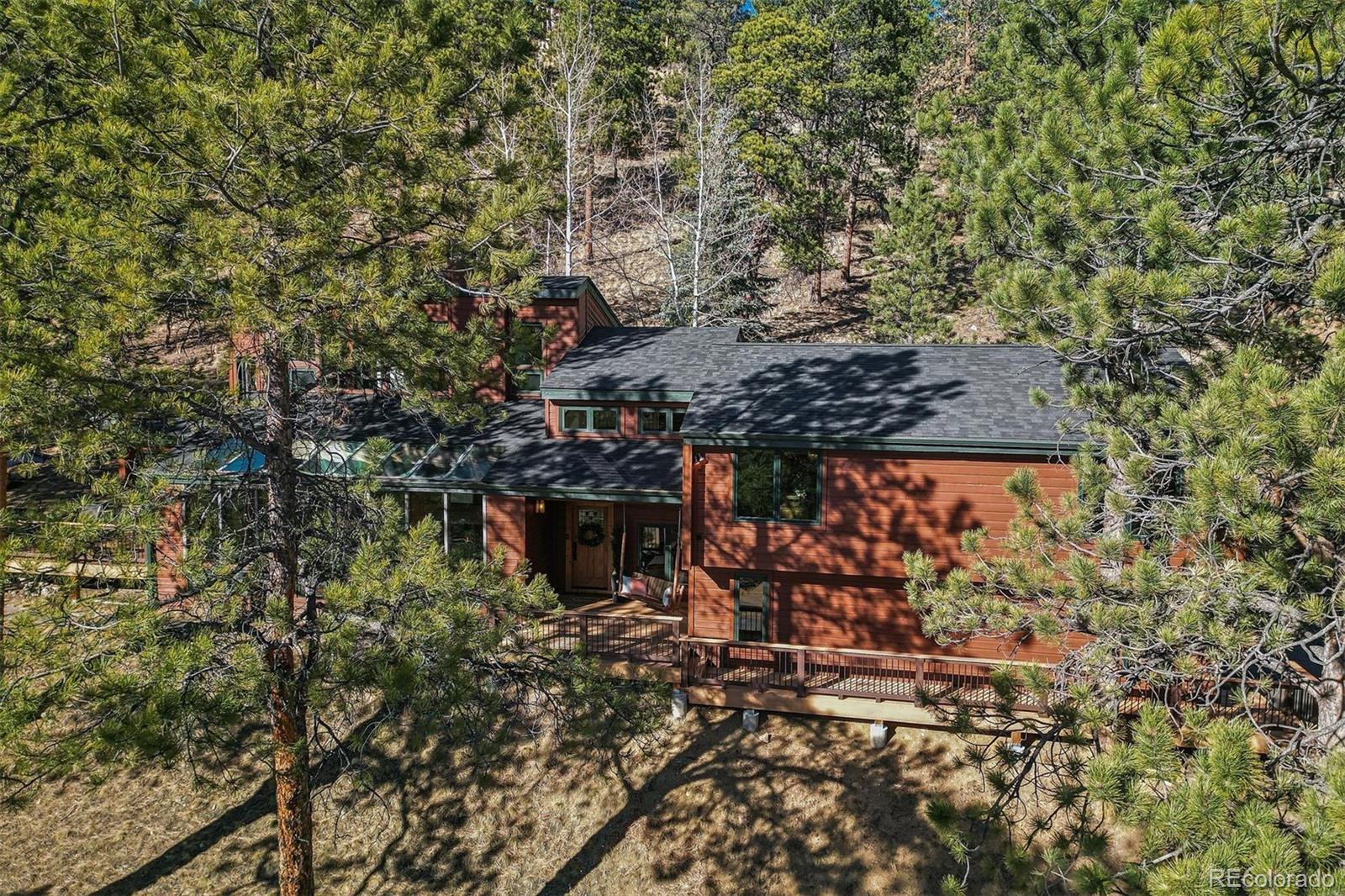 67 Oak Way Evergreen, CO 80439 - Photo 14 of 44 a view of a wooden building