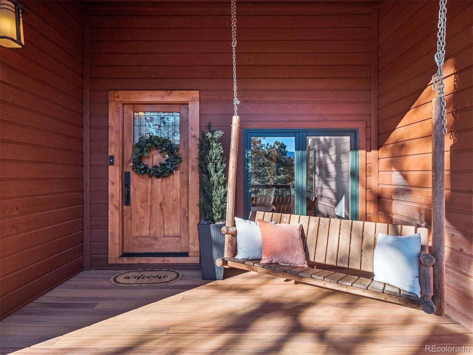 67 Oak Way Evergreen, CO 80439 - Photo 15 of 44 a view of a door with a roof deck