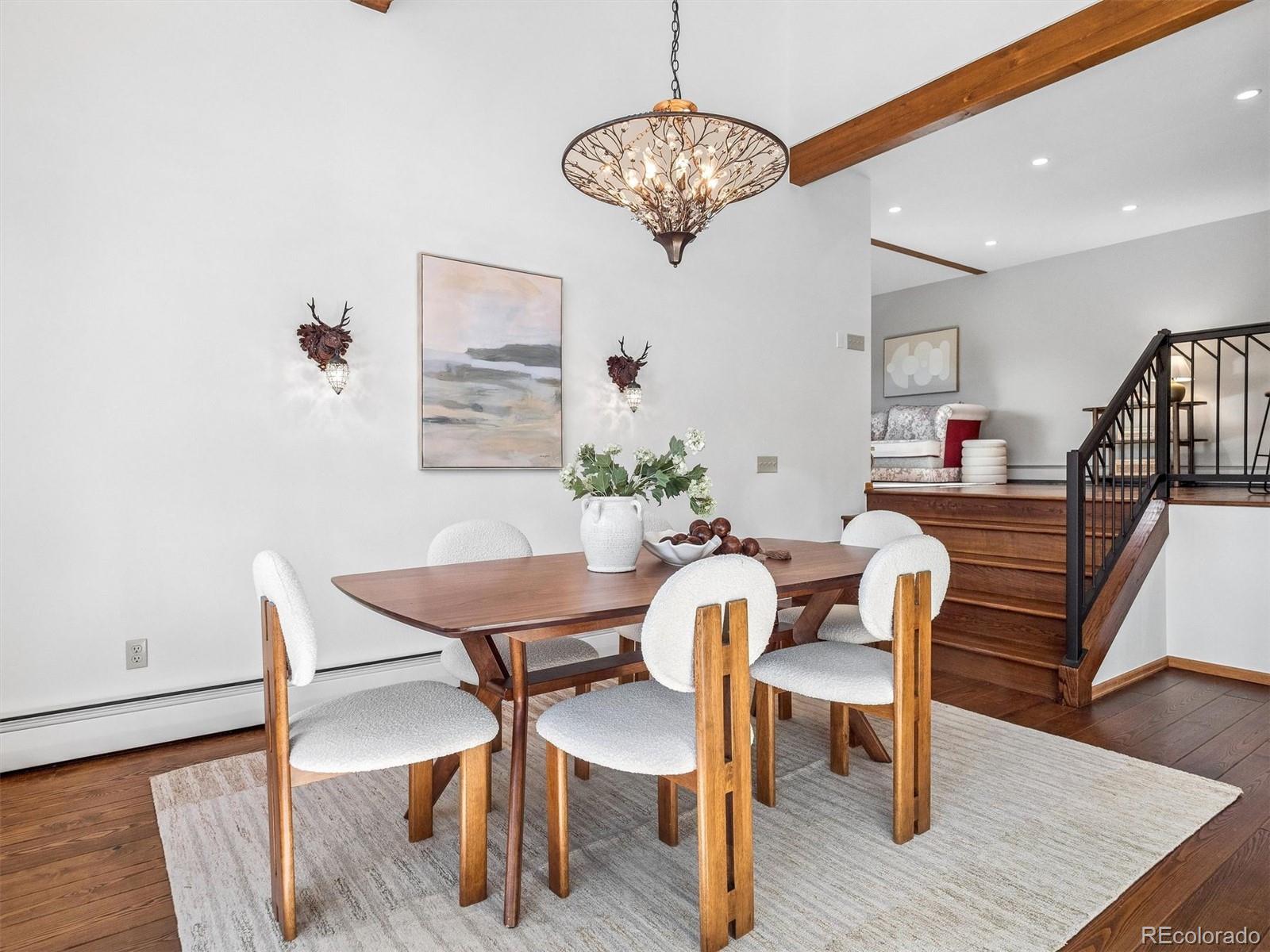 67 Oak Way Evergreen, CO 80439 - Photo 18 of 44 a view of a dining room with furniture and wooden floor