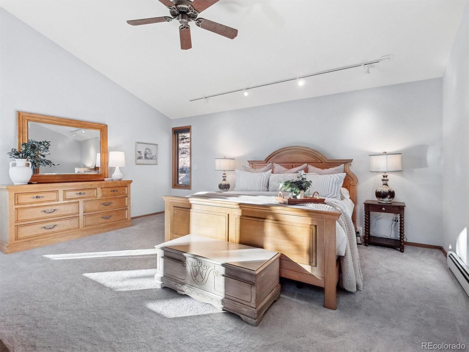 67 Oak Way Evergreen, CO 80439 - Photo 26 of 44 a living room with furniture and a ceiling fan