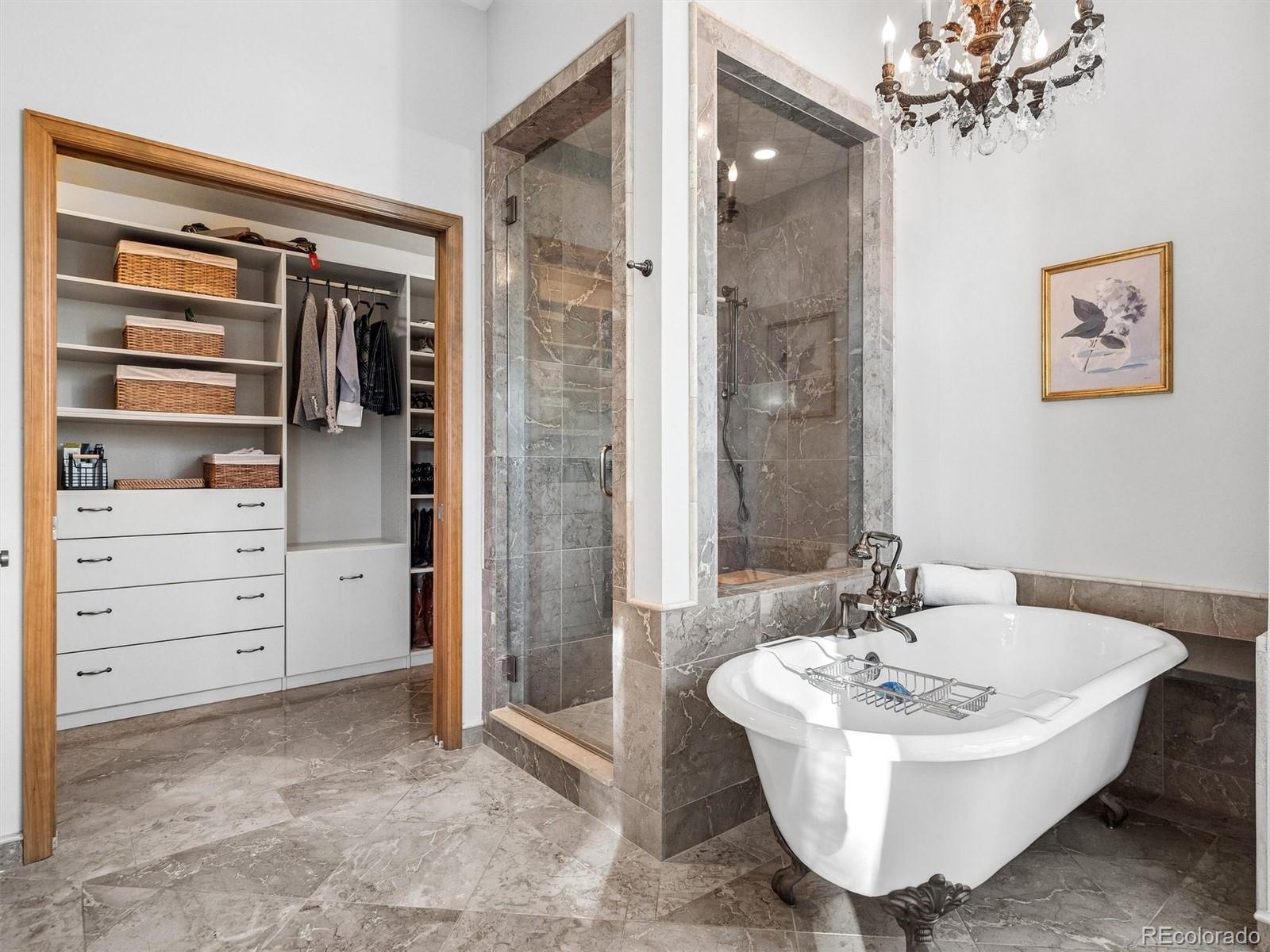 67 Oak Way Evergreen, CO 80439 - Photo 29 of 44 a bathroom with a sink a mirror and a bathtub