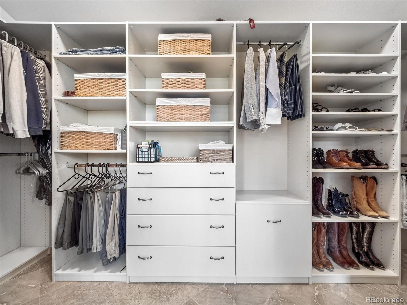 67 Oak Way Evergreen, CO 80439 - Photo 30 of 44 a view of walk in closet with clothes and shoes