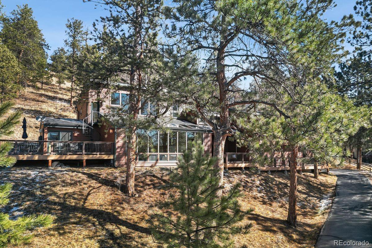 67 Oak Way Evergreen, CO 80439 - Photo 32 of 44 a view of a house with a yard