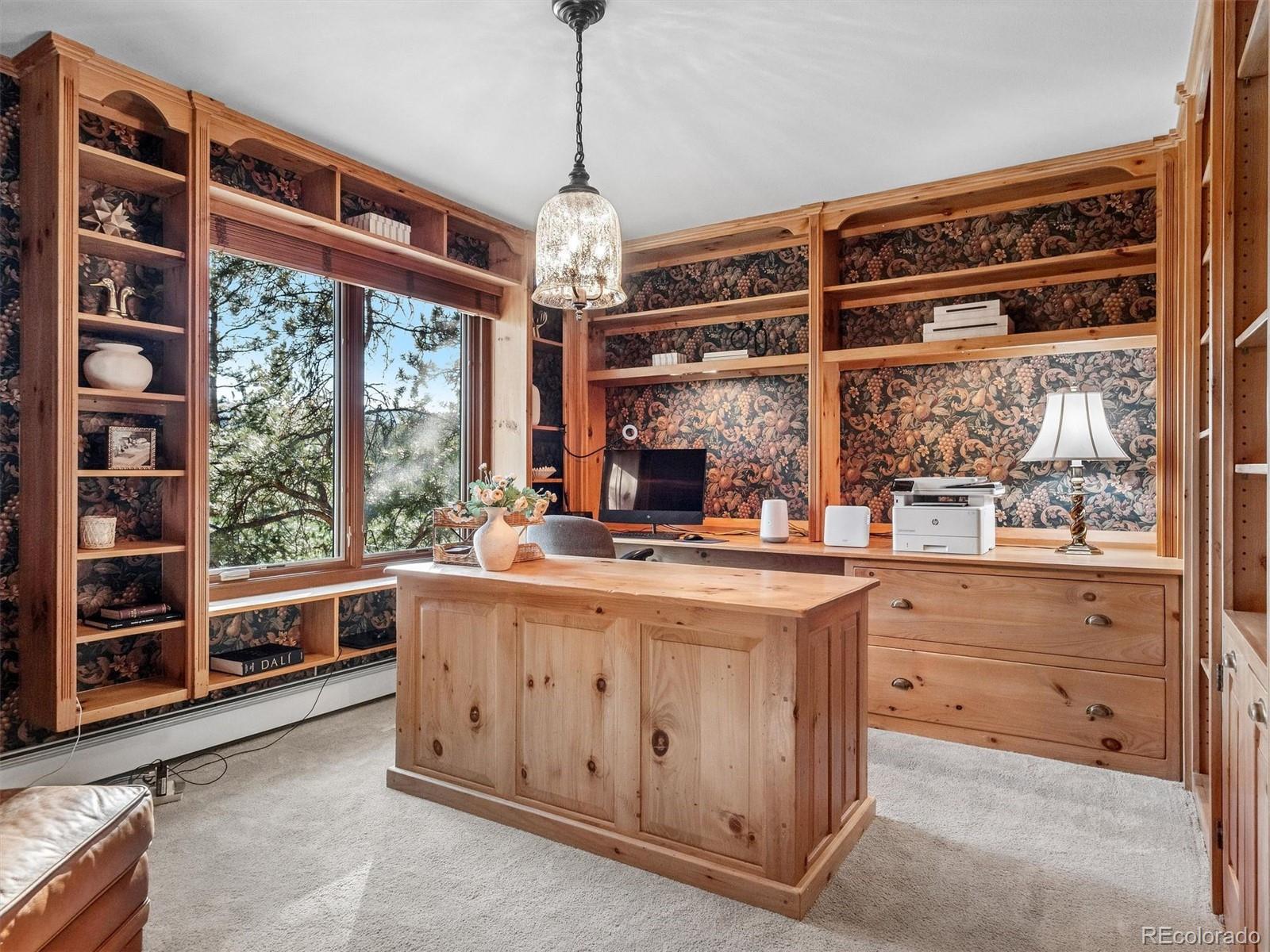 67 Oak Way Evergreen, CO 80439 - Photo 37 of 44 a kitchen with stainless steel appliances granite countertop a stove and a sink