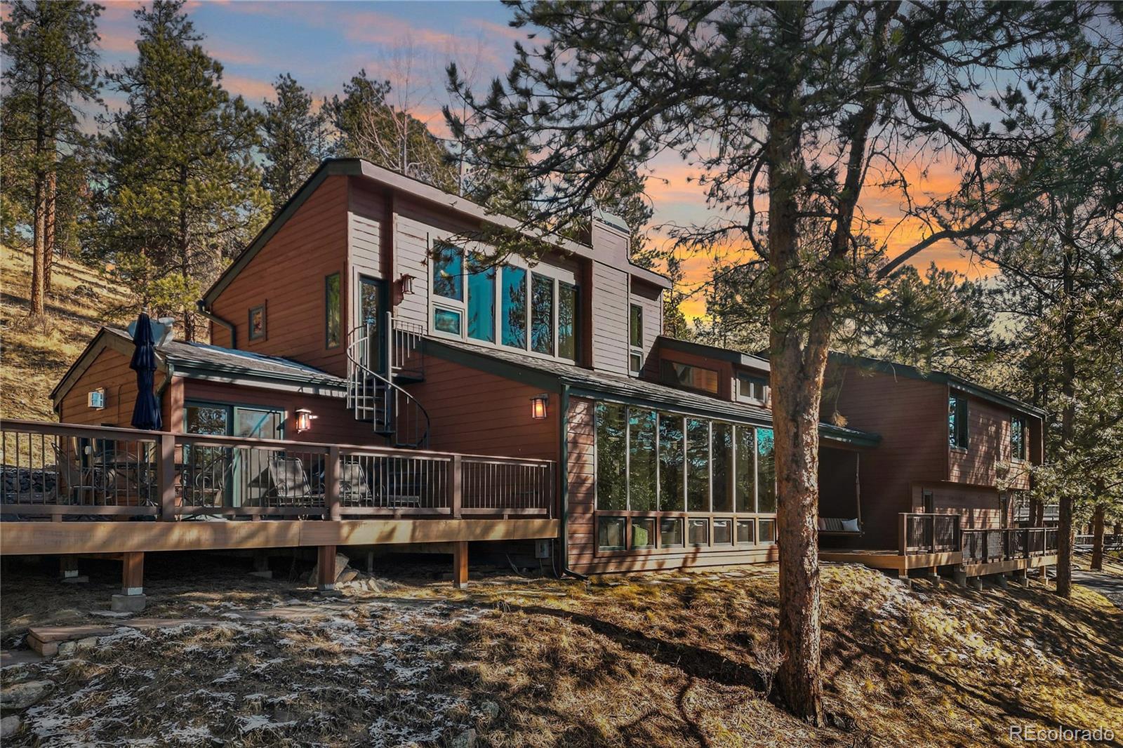 67 Oak Way Evergreen, CO 80439 - Photo 44 of 44 a house view with a garden space