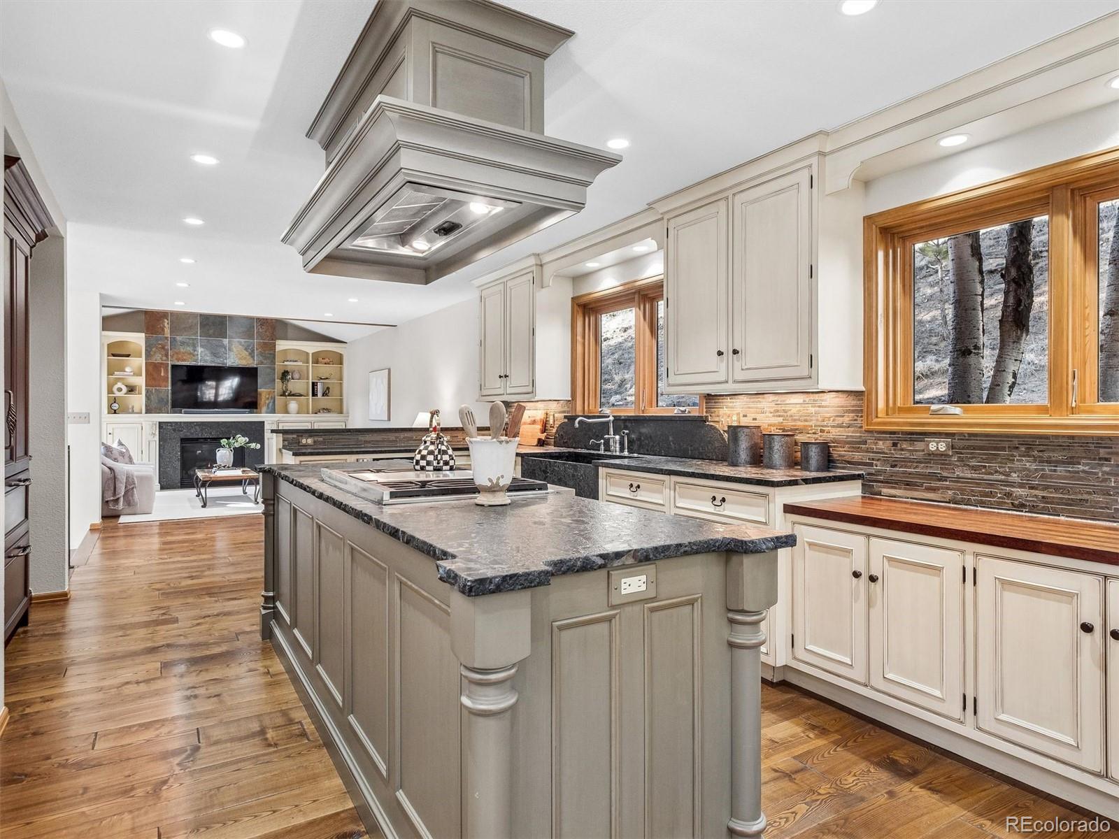 67 Oak Way Evergreen, CO 80439 - Photo 7 of 44 a kitchen with stainless steel appliances granite countertop a sink and cabinets
