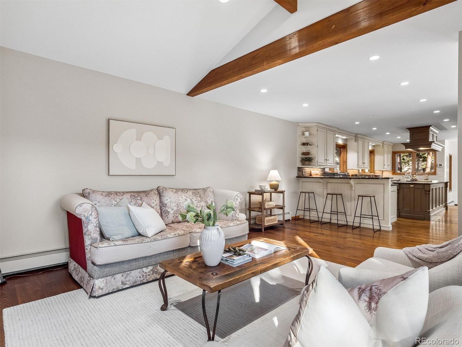 67 Oak Way Evergreen, CO 80439 - Photo 10 of 44 a living room with furniture kitchen view and a table