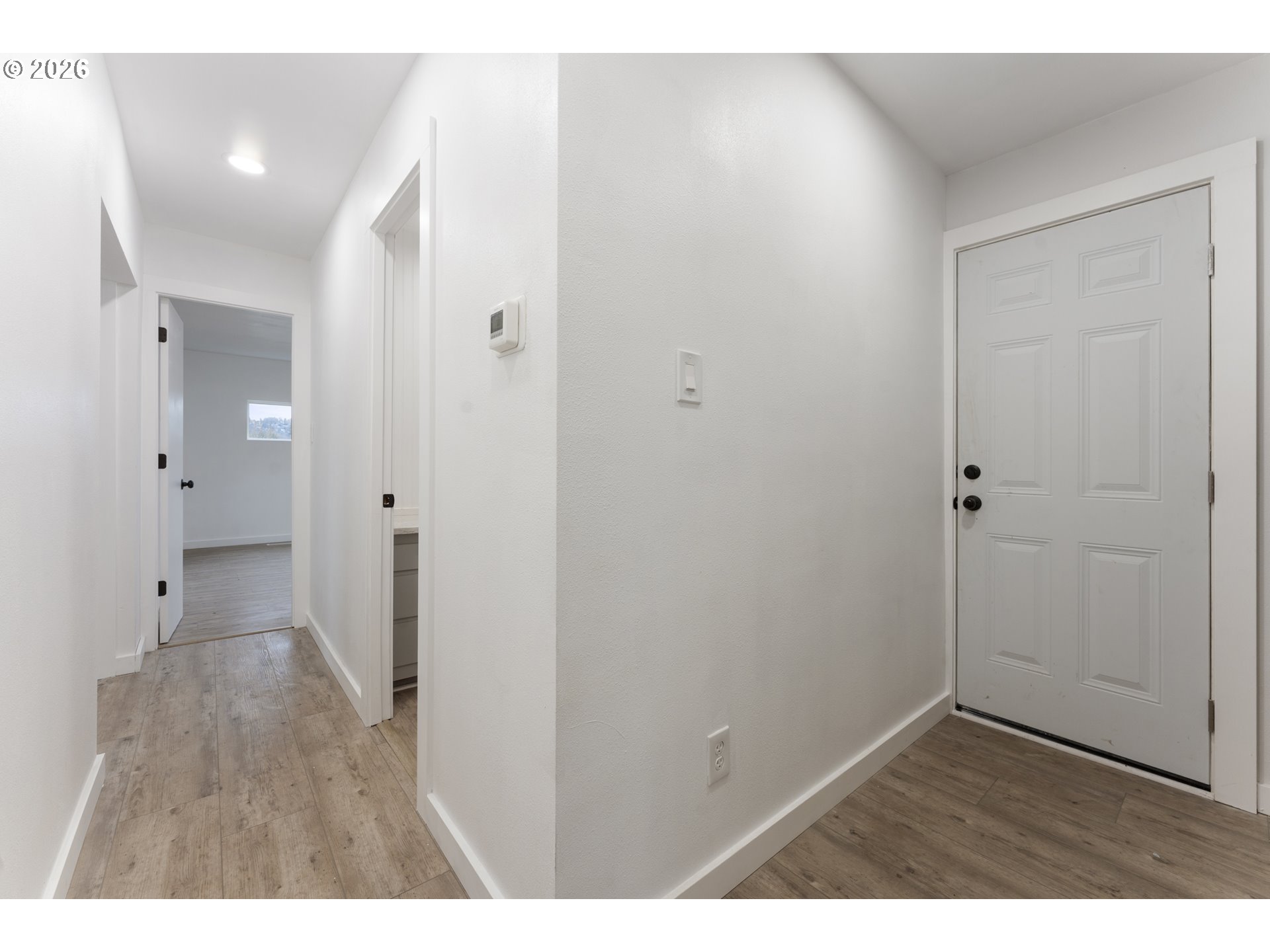 4424 Southeast Roethe Road, Unit 3 Milwaukie, OR 97267 - Photo 16 of 30 a view of an empty room with wooden floor