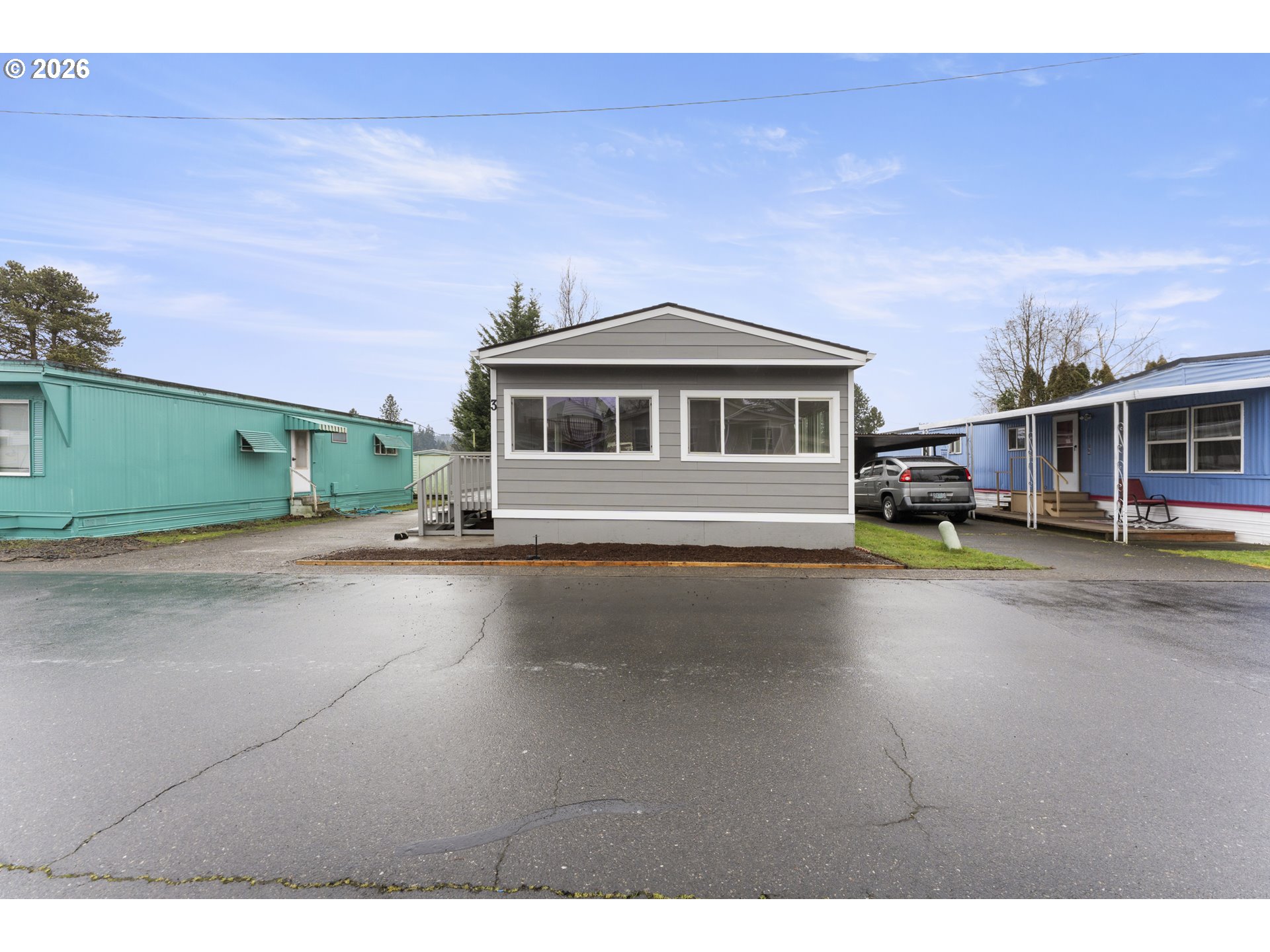 4424 Southeast Roethe Road, Unit 3 Milwaukie, OR 97267 - Photo 2 of 30 a front view of a house with a street