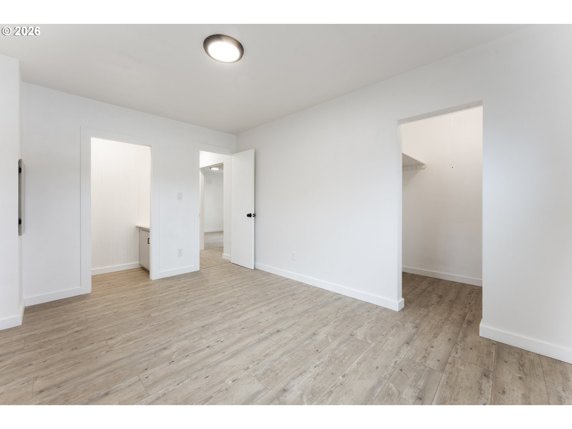 4424 Southeast Roethe Road, Unit 3 Milwaukie, OR 97267 - Photo 21 of 30 a view of an empty room with wooden floor