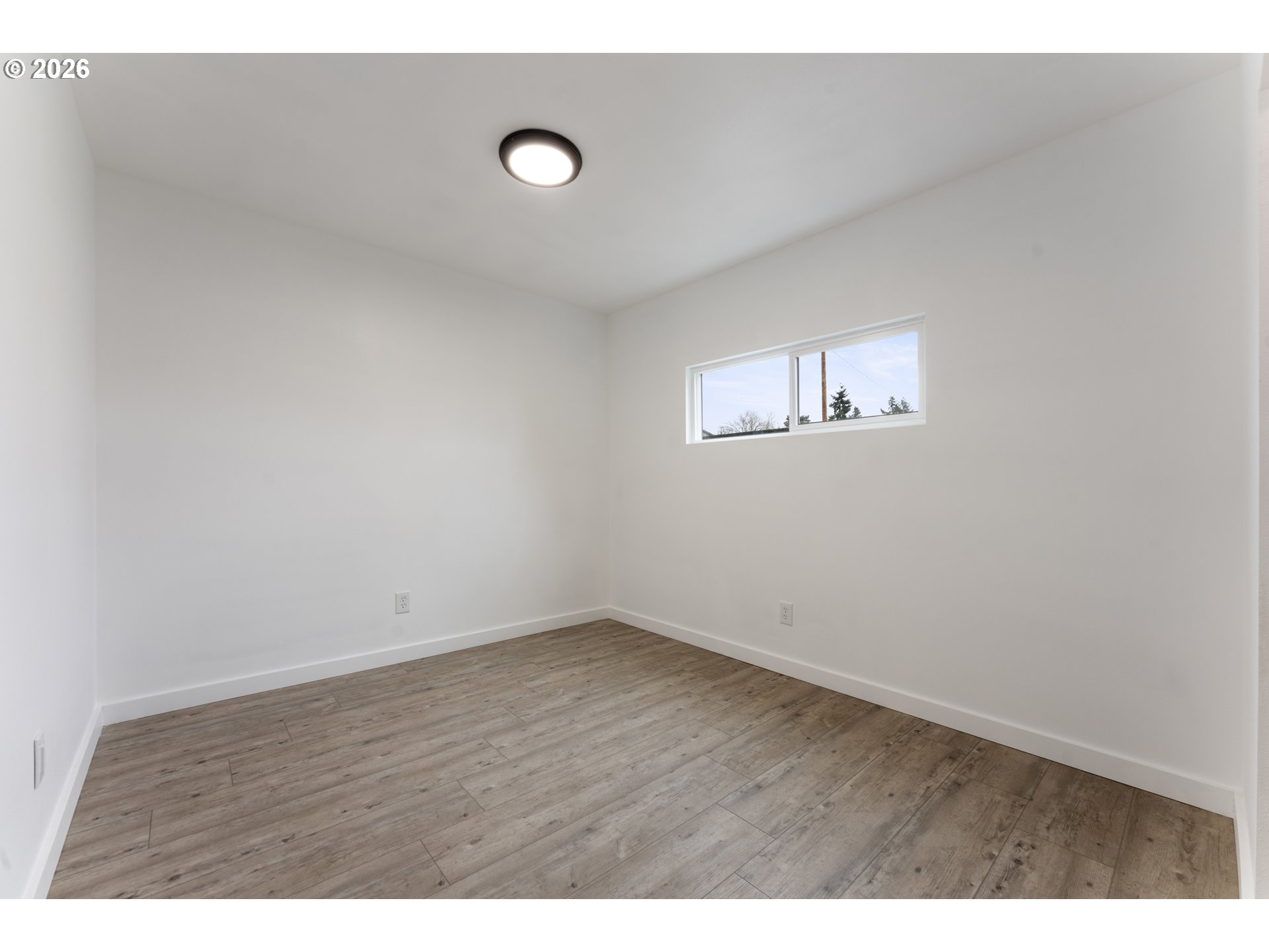 4424 Southeast Roethe Road, Unit 3 Milwaukie, OR 97267 - Photo 27 of 30 a view of an empty room with a window