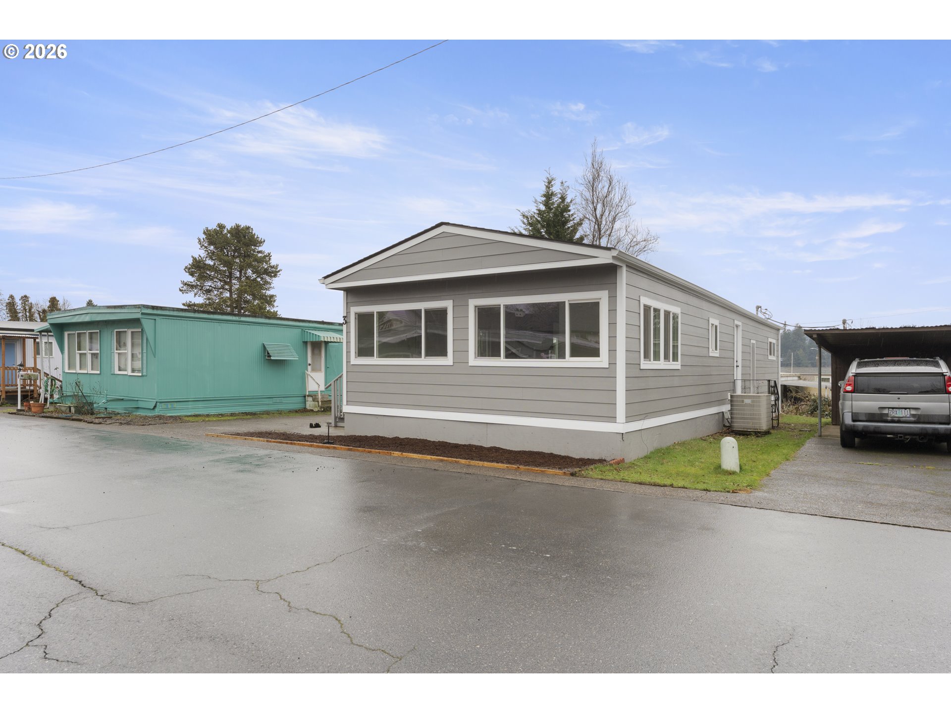 4424 Southeast Roethe Road, Unit 3 Milwaukie, OR 97267 - Photo 3 of 30 a view of a house with a backyard