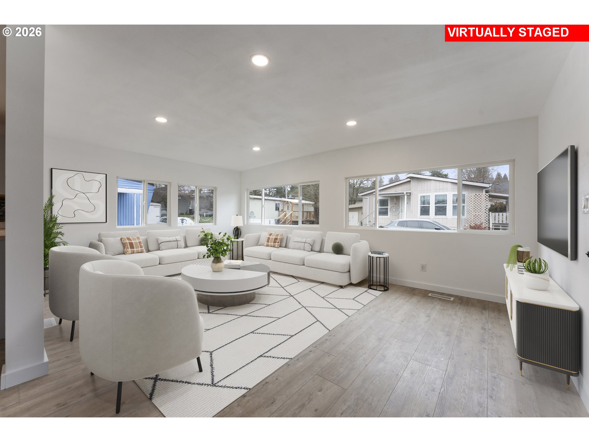 4424 Southeast Roethe Road, Unit 3 Milwaukie, OR 97267 - Photo 8 of 30 a living room with fireplace furniture and a flat screen tv