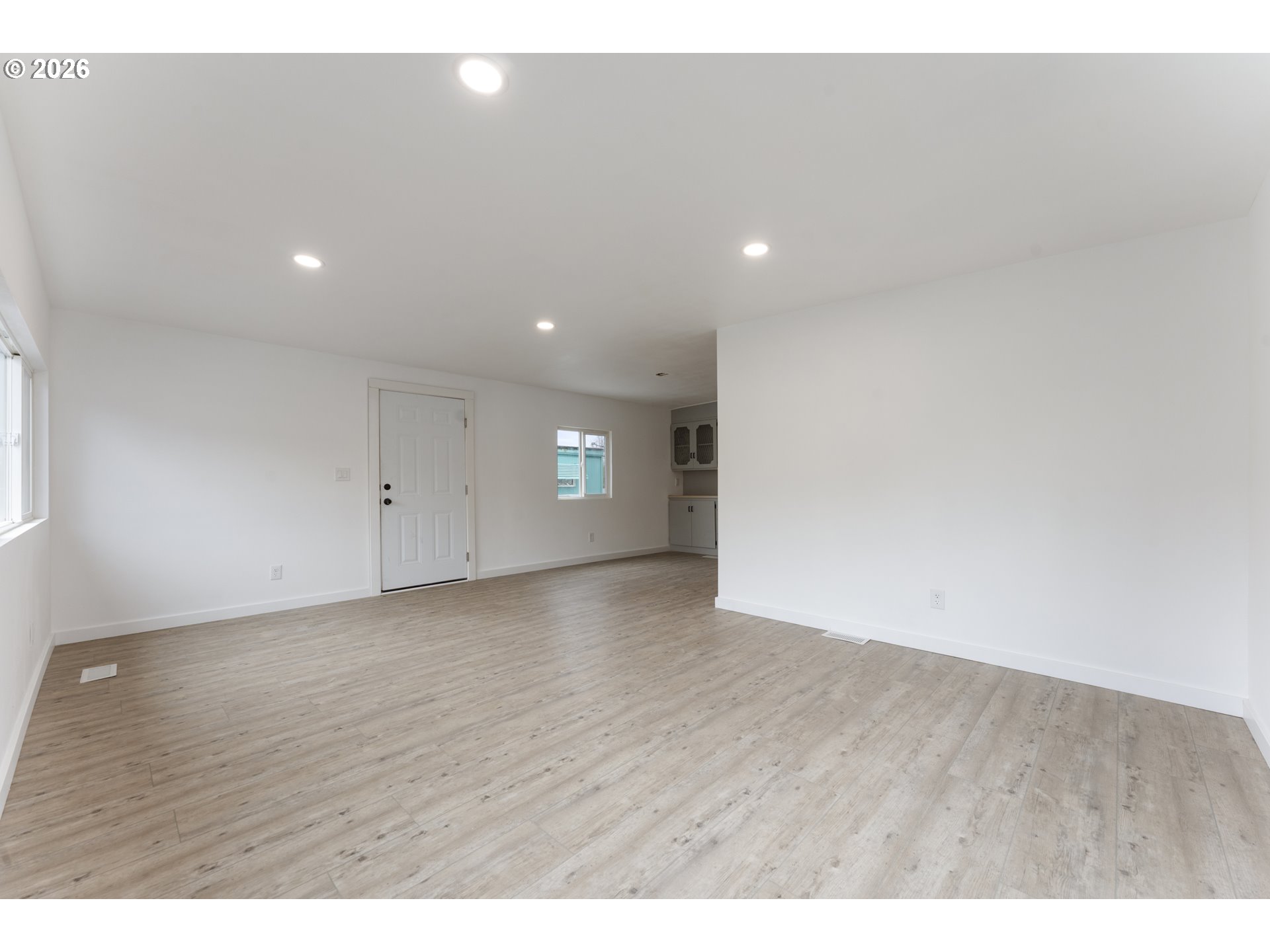 4424 Southeast Roethe Road, Unit 3 Milwaukie, OR 97267 - Photo 10 of 30 a view of an empty room with wooden floor