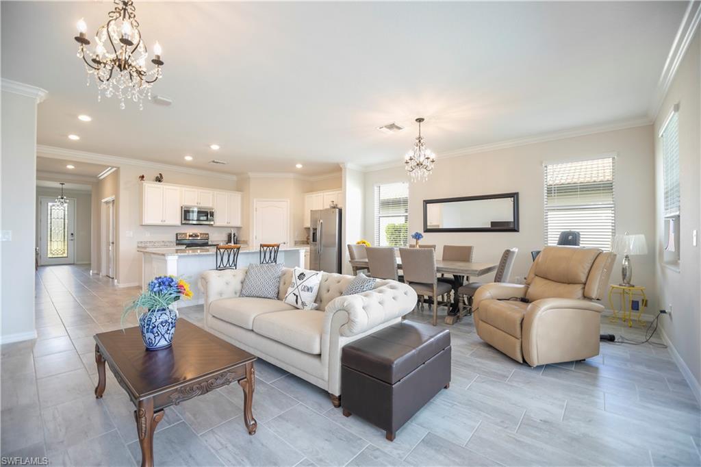 2075 Parson Street Naples, FL 34120 - Photo 4 of 15 a living room with furniture kitchen view and a chandelier