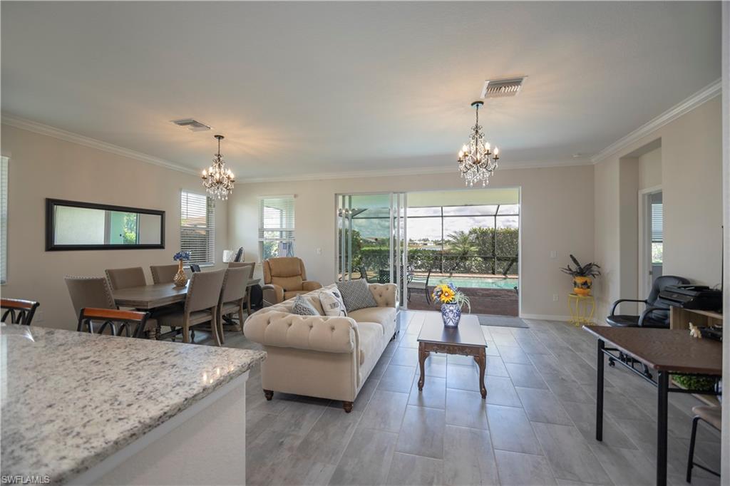 2075 Parson Street Naples, FL 34120 - Photo 6 of 15 a living room with furniture and a chandelier