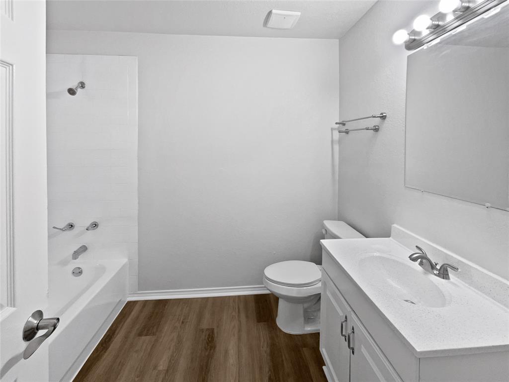 4346 Hamilton Avenue Dallas, TX 75210 - Photo 5 of 16 a bathroom with a sink toilet and shower