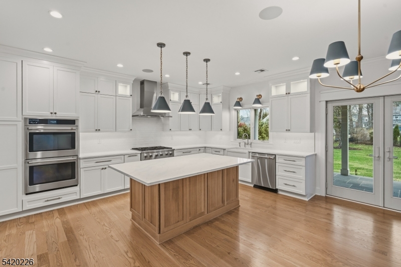 732 Embree Crescent Westfield, NJ 07090 - Photo 11 of 47 a kitchen with a stove a sink and a refrigerator