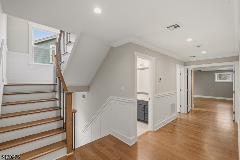 732 Embree Crescent Westfield, NJ 07090 - Photo 15 of 47 a view of entryway with wooden floor and stairs