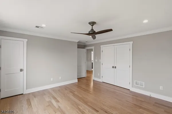 a bathroom with a shower sink mirror and toilet