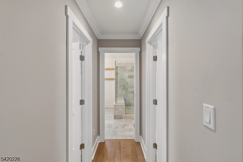 732 Embree Crescent Westfield, NJ 07090 - Photo 25 of 47 a view of a hallway with wooden floor and closet