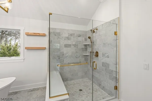 a bathroom with a sink a mirror and a toilet