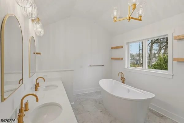 a bathroom with a bathtub and shower