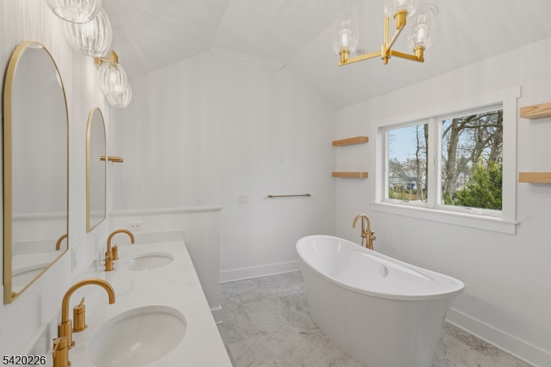 732 Embree Crescent Westfield, NJ 07090 - Photo 29 of 47 a bathroom with a sink a mirror and a toilet