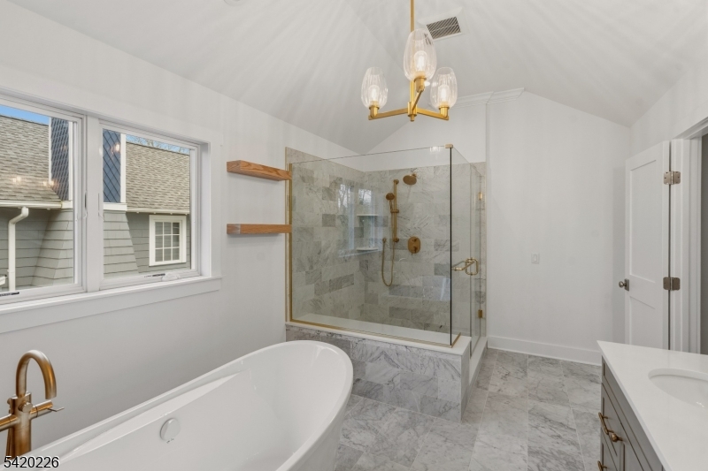 732 Embree Crescent Westfield, NJ 07090 - Photo 30 of 47 a bathroom with a bathtub and shower
