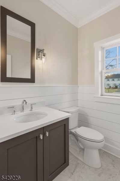 732 Embree Crescent Westfield, NJ 07090 - Photo 4 of 47 a bathroom with a toilet sink vanity and mirror