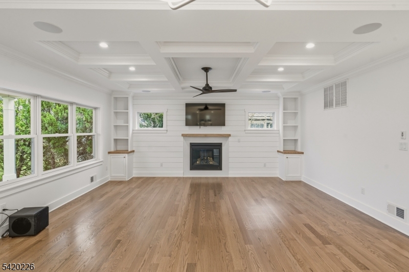 732 Embree Crescent Westfield, NJ 07090 - Photo 8 of 47 a view of an empty room with a fireplace and a window