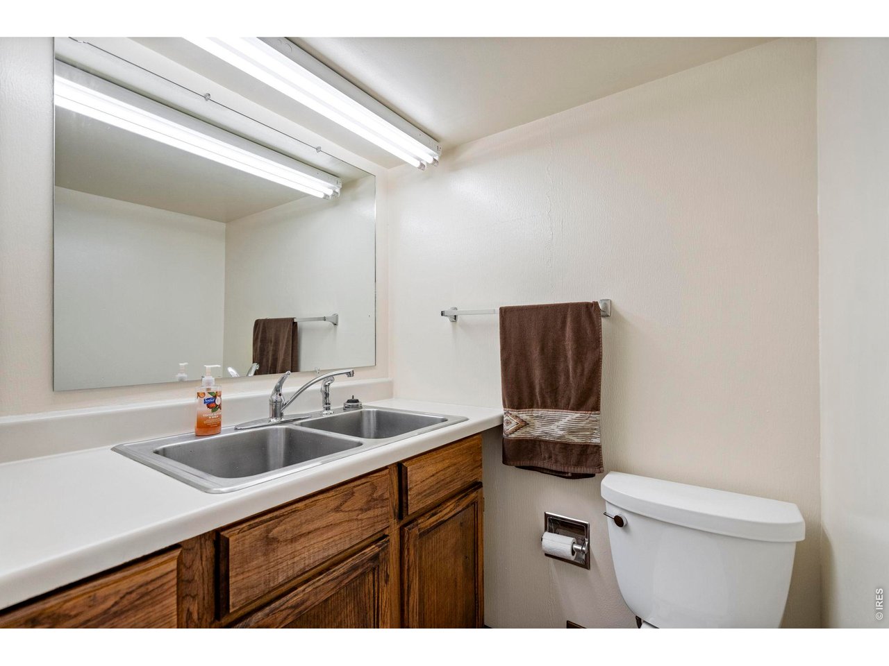 300 Ranch Acres Drive Loveland, CO 80538 - Photo 24 of 38 a kitchen with a sink and a toilet