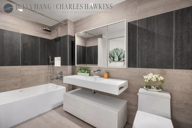 a bedroom with bed and wooden floor